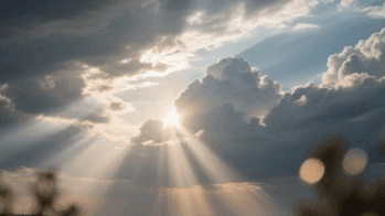 Blog Clouds parting with bright sunlight shining through